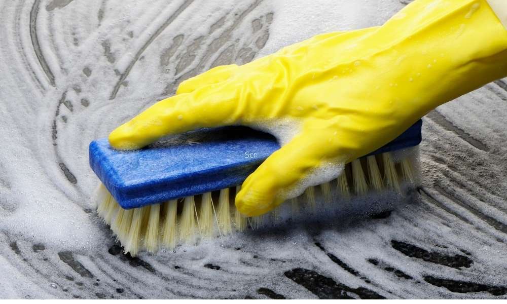 Scrubbing To Clean Discolored Enamel Cookware