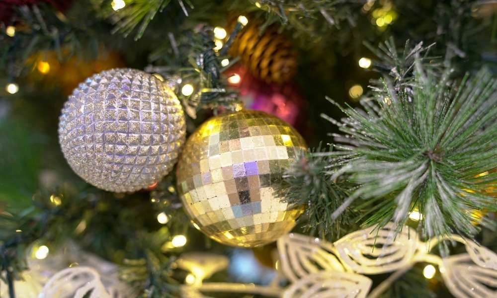 Hang Lighted Ornaments To Decorate Outdoor Trees With Lights