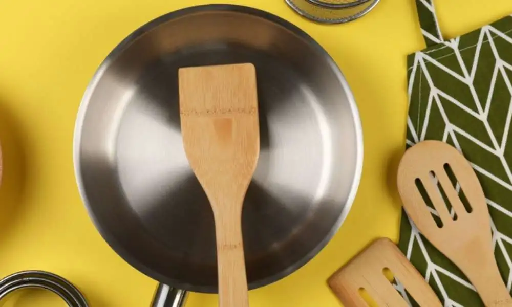 Cleaning Stubborn Stains with a wooden spoon